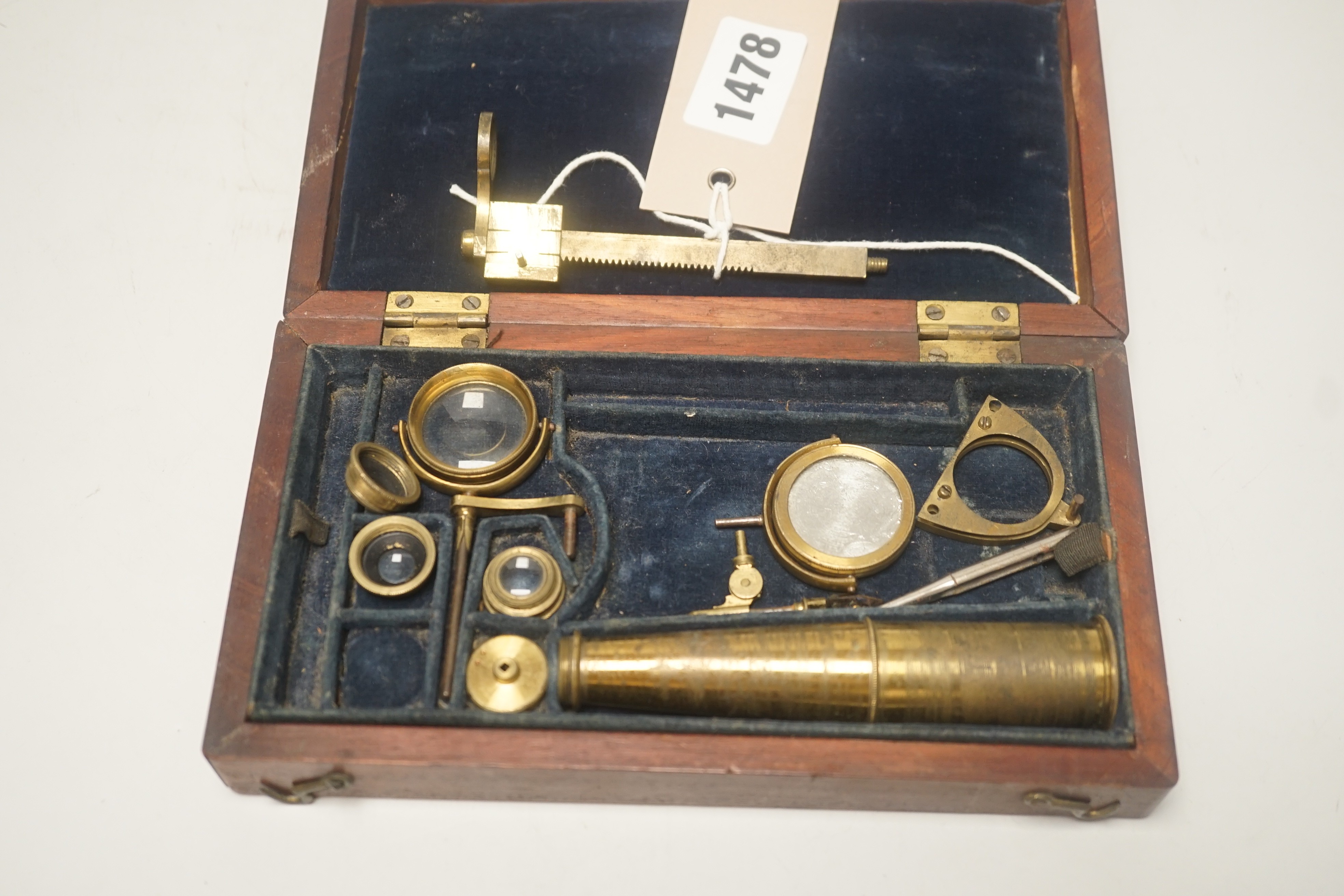 A 19th century monocular microscope, in mahogany case